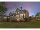 Expansive backyard view of a two-story home, deck, and patio at 895 Ovalene Sw Ln, Marietta, GA 30064