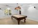Basement game room featuring a classic billiard table, chandelier and speakers at 895 Ovalene Sw Ln, Marietta, GA 30064