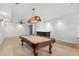 Basement game room featuring a classic billiard table, adjacent to a bar at 895 Ovalene Sw Ln, Marietta, GA 30064
