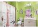 Charming bathroom with decorative wallpaper, a stylish shower curtain, and unique fixtures at 895 Ovalene Sw Ln, Marietta, GA 30064