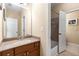 Bathroom featuring warm beige walls and a brown vanity, creating a cozy and inviting space at 895 Ovalene Sw Ln, Marietta, GA 30064