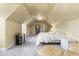 Bright bedroom with carpet flooring, vaulted ceilings, a queen sized bed, and comfortable seating at 895 Ovalene Sw Ln, Marietta, GA 30064