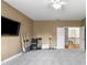 Bedroom showing access to hallway, neutral colors, ceiling fan, and natural light at 895 Ovalene Sw Ln, Marietta, GA 30064