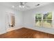 Bedroom with wood floors, ceiling fan, and ensuite bathroom at 895 Ovalene Sw Ln, Marietta, GA 30064