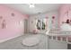 A cozy Bedroom with soft colors, a crib, and plenty of natural light at 895 Ovalene Sw Ln, Marietta, GA 30064
