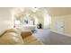 Spacious bedroom featuring vaulted ceilings, plush carpet, a cozy seating area and a queen-sized bed at 895 Ovalene Sw Ln, Marietta, GA 30064