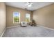 Cozy bedroom with soft carpet, two windows with plenty of natural light, and a ceiling fan at 895 Ovalene Sw Ln, Marietta, GA 30064