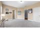 Bonus room featuring three doorways and a large carpeted space, providing flexibility for various uses at 895 Ovalene Sw Ln, Marietta, GA 30064