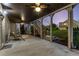 Relaxing covered patio featuring a ceiling fan, swing, and view of the backyard at 895 Ovalene Sw Ln, Marietta, GA 30064