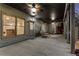 Well-lit covered patio with an outdoor ceiling fan and view into the home's living room at 895 Ovalene Sw Ln, Marietta, GA 30064