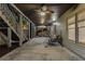 Spacious covered patio with a swing, stairs, and a view of the backyard at 895 Ovalene Sw Ln, Marietta, GA 30064
