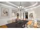 Dining room with seating, hardwood floors, wainscoting, and chandelier at 895 Ovalene Sw Ln, Marietta, GA 30064
