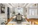 Dining room with hardwood floors, wainscoting, elegant chandelier, and lots of light at 895 Ovalene Sw Ln, Marietta, GA 30064
