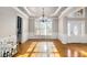 Dining room featuring hardwood floors, chandelier, and a butler's pantry at 895 Ovalene Sw Ln, Marietta, GA 30064