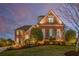 Charming brick home featuring manicured lawn and mature shrubbery at 895 Ovalene Sw Ln, Marietta, GA 30064
