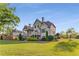 Rear exterior view of the house with decks, porch and beautiful landscaping at 895 Ovalene Sw Ln, Marietta, GA 30064