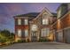Handsome brick and stone home with a welcoming front entrance and 3-car garage at 895 Ovalene Sw Ln, Marietta, GA 30064