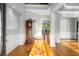 Bright foyer with gleaming hardwood floors, decorative molding, and views to the living spaces at 895 Ovalene Sw Ln, Marietta, GA 30064