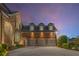 Attached three-car garage with beautiful stone and brick exterior at 895 Ovalene Sw Ln, Marietta, GA 30064