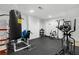 Home gym with fitness equipment, including an exercise machine and punching bag at 895 Ovalene Sw Ln, Marietta, GA 30064