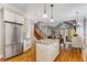 Spacious kitchen featuring white cabinetry, stainless steel appliances, and views to the Gathering room at 895 Ovalene Sw Ln, Marietta, GA 30064