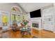 Bright living room with hardwood floors, fireplace, built-ins, and view to the porch at 895 Ovalene Sw Ln, Marietta, GA 30064