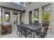 Outdoor dining area on the patio with grill and view of the well-maintained backyard at 895 Ovalene Sw Ln, Marietta, GA 30064