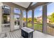 Covered patio with modern decor and ample space for outdoor seating overlooking backyard at 895 Ovalene Sw Ln, Marietta, GA 30064