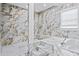Modern bathroom featuring a walk-in shower and a soaking tub at 1081 Humphries Nw Rd, Conyers, GA 30012