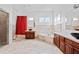 An elegant bathroom with marble features, separate shower, soaking tub, and dark wood cabinets at 1081 Humphries Nw Rd, Conyers, GA 30012