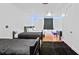 Spacious bedroom featuring four beds, hardwood floors, and modern lighting at 1081 Humphries Nw Rd, Conyers, GA 30012