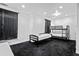 Bright bedroom featuring black bunk beds and ample space, creating a versatile and comfortable atmosphere at 1081 Humphries Nw Rd, Conyers, GA 30012