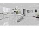 A large kitchen with marble countertops, an island, and stainless appliances at 1081 Humphries Nw Rd, Conyers, GA 30012