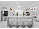 A modern kitchen with white cabinets and marble countertops at 1081 Humphries Nw Rd, Conyers, GA 30012