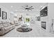 Expansive living room featuring a fireplace, modern furniture, and ample seating at 1081 Humphries Nw Rd, Conyers, GA 30012