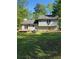 A spacious backyard with a deck, perfect for outdoor relaxation and entertaining at 4775 Ben Hill Rd, Douglasville, GA 30134