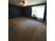 Dark bedroom with window and curtains at 4775 Ben Hill Rd, Douglasville, GA 30134