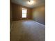 Neutral bedroom featuring carpet and window at 4775 Ben Hill Rd, Douglasville, GA 30134