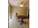 Simple dining area with neutral walls and a ceiling fan, perfect for enjoying meals in a bright and comfortable setting at 4775 Ben Hill Rd, Douglasville, GA 30134