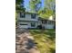 Charming two-story home with a one-car garage and well-maintained front yard at 4775 Ben Hill Rd, Douglasville, GA 30134