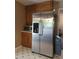 An efficient kitchen featuring oak cabinets, stainless steel appliances, and patterned vinyl flooring for a clean and organized cooking space at 4775 Ben Hill Rd, Douglasville, GA 30134