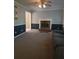 Comfortable living room with fireplace, ceiling fan, and gray couch at 4775 Ben Hill Rd, Douglasville, GA 30134