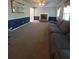 Comfortable living room with fireplace, ceiling fan, and gray couch at 4775 Ben Hill Rd, Douglasville, GA 30134