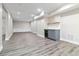 Finished basement featuring luxury vinyl plank flooring, cabinets, and wet bar with a wine fridge at 617 Wexford Ct, Acworth, GA 30102