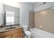 Cozy bathroom with shower and tub combo and a modern sink at 617 Wexford Ct, Acworth, GA 30102