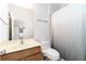 Standard bathroom featuring a vanity, toilet, mirror, and a shower with a curtain, functional and clean at 617 Wexford Ct, Acworth, GA 30102
