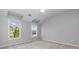 Bedroom with carpet flooring, and view of houses through the windows at 617 Wexford Ct, Acworth, GA 30102