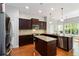 Kitchen featuring wood floors, granite countertops, stainless steel appliances and a center island at 617 Wexford Ct, Acworth, GA 30102
