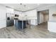 Open kitchen featuring white cabinets, granite countertops, stainless steel appliances, and island at 617 Wexford Ct, Acworth, GA 30102