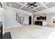 Cozy living room with a fireplace, view of the staircase, and a glimpse into the dark-stained kitchen at 617 Wexford Ct, Acworth, GA 30102